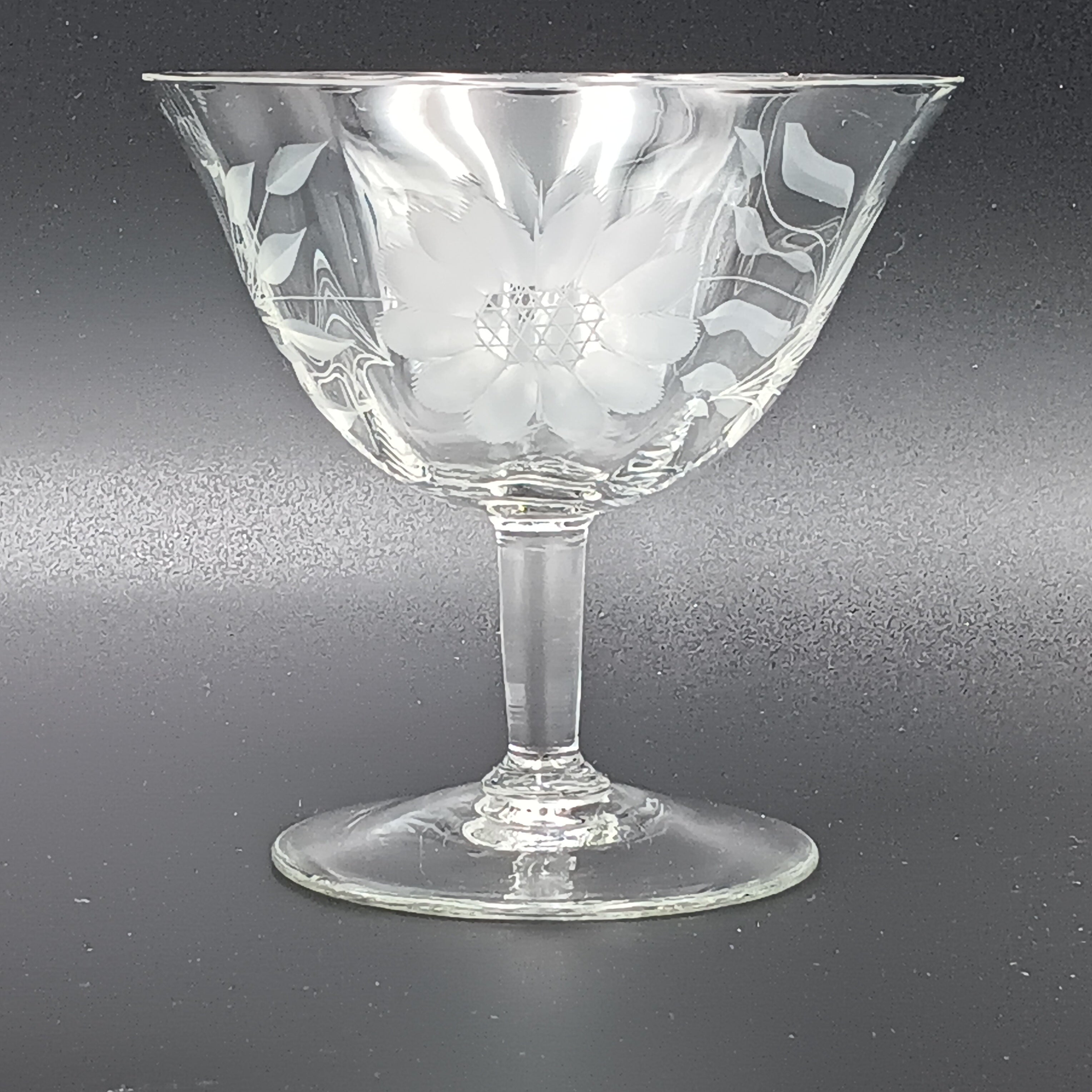 Vintage W.J. Hughes Cornflower sherbet glass with etched floral design, featuring a wide bowl, short stem, and flat base, crafted from clear crystal