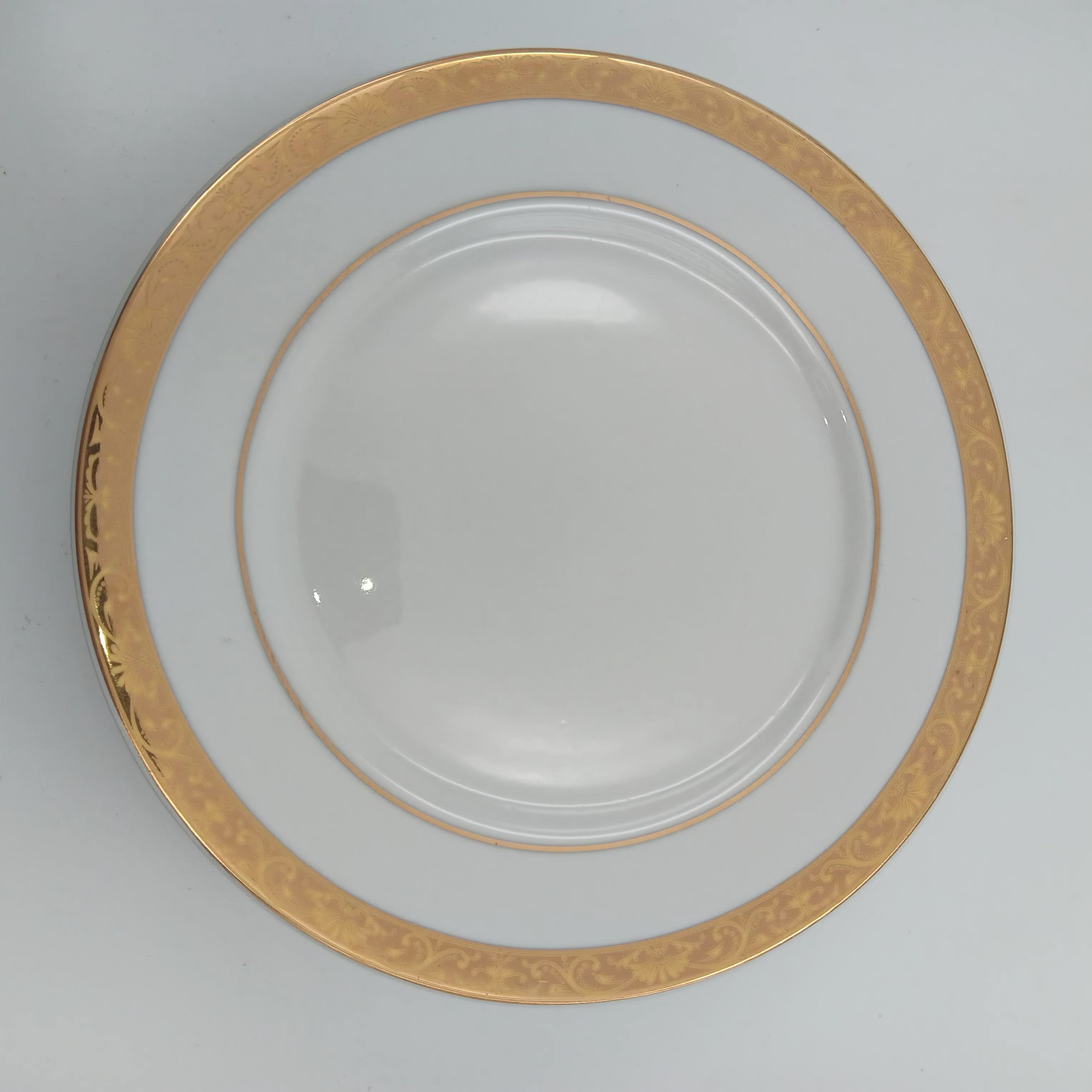 Elegant white porcelain Bread & Butter plate with gold trim from luxury china set