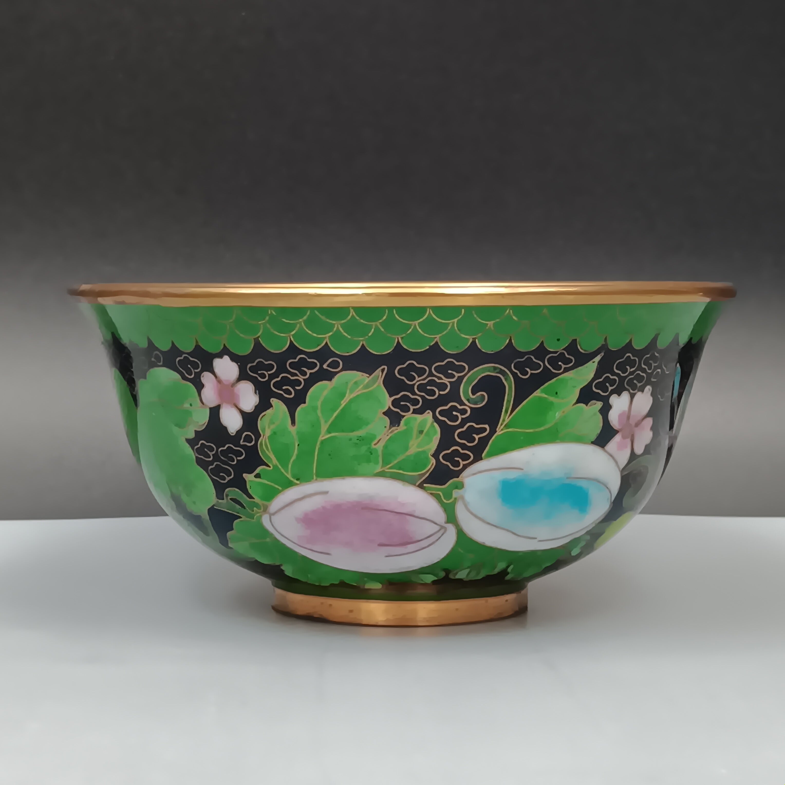Mid-century Chinese cloisonné enamel bowl with blue interior and floral brass exterior, 5-inch diameter