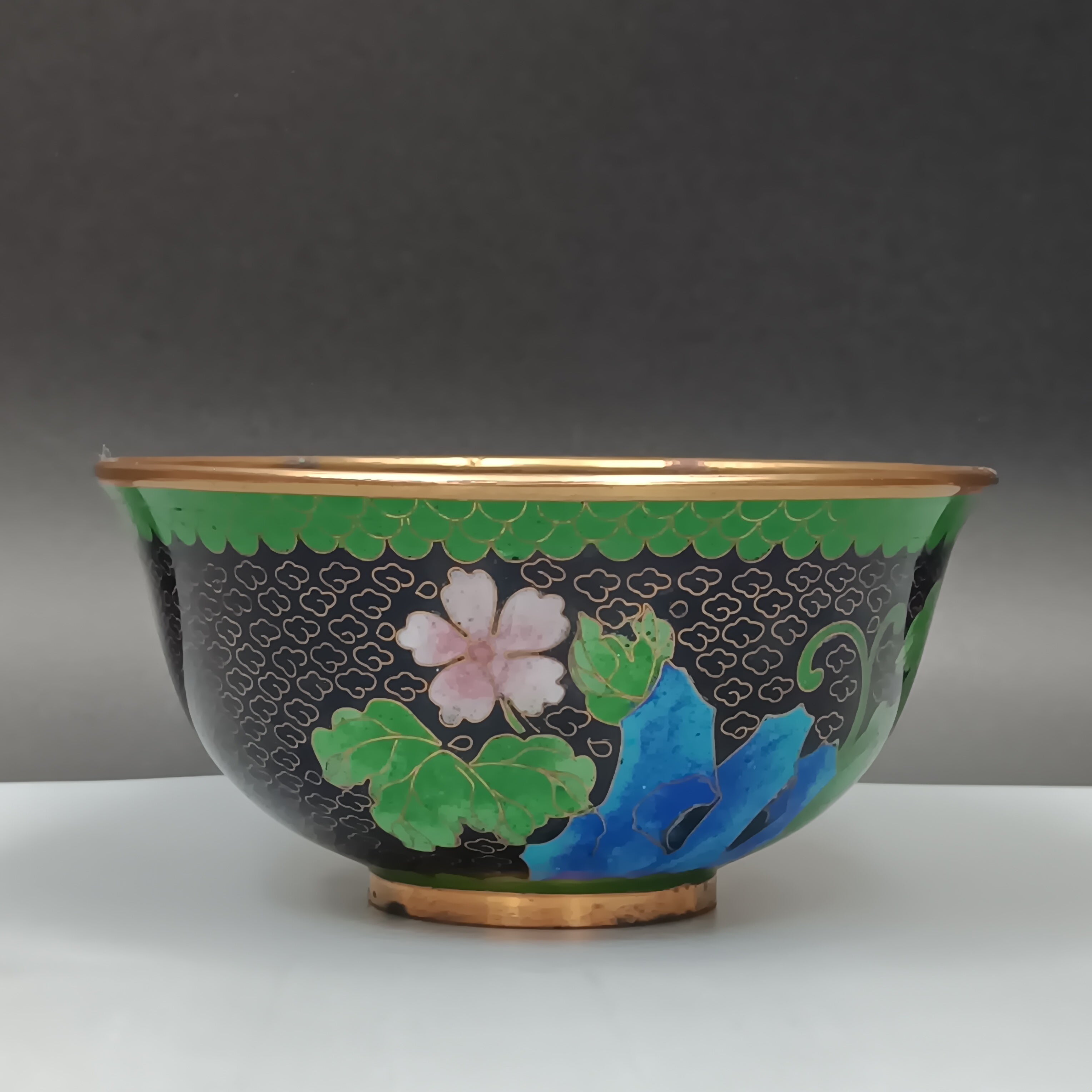 Mid-century Chinese cloisonné enamel bowl with blue interior and floral brass exterior, 5-inch diameter