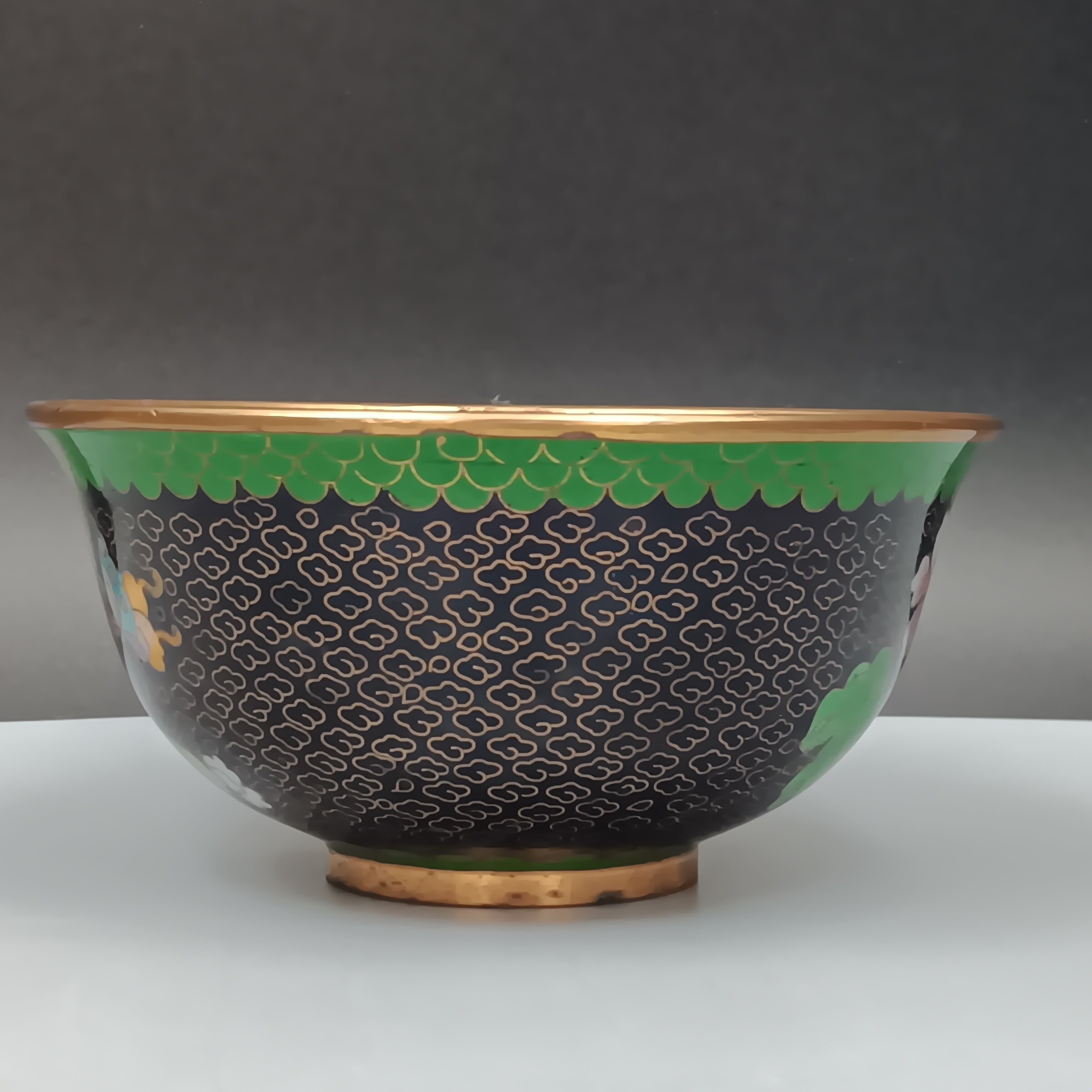 Mid-century Chinese cloisonné enamel bowl with blue interior and floral brass exterior, 5-inch diameter
