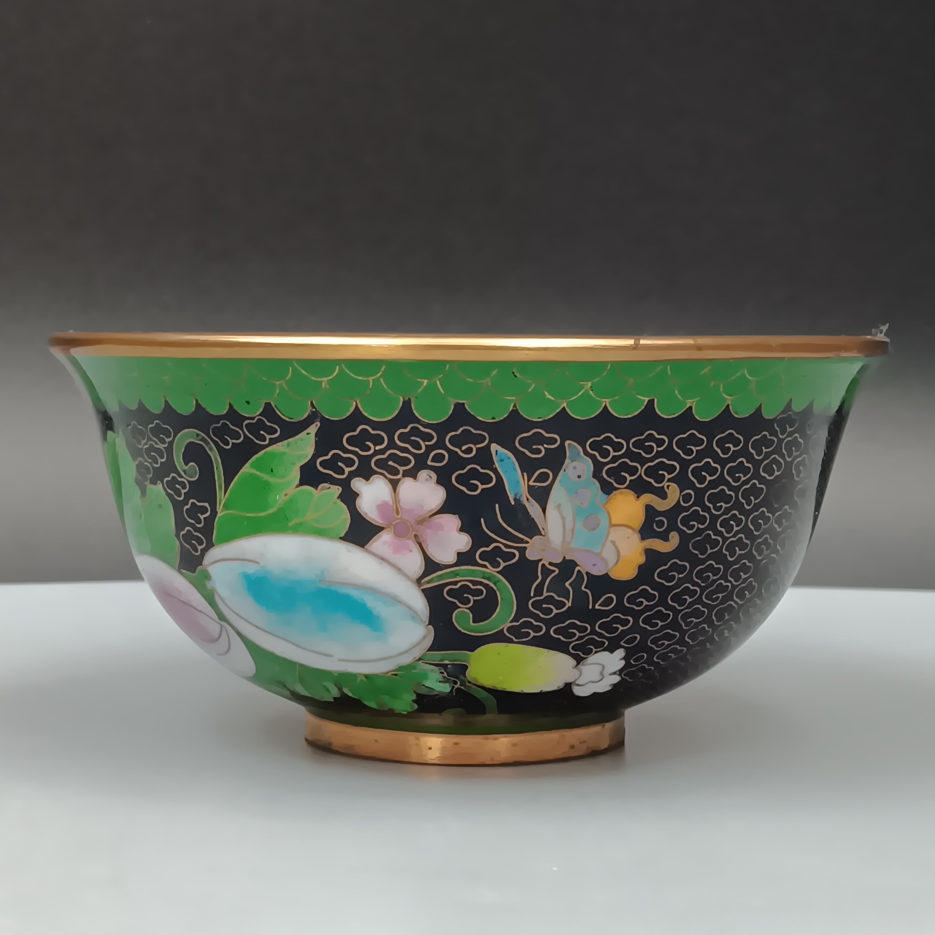 Mid-century Chinese cloisonné enamel bowl with blue interior and floral brass exterior, 5-inch diameter
