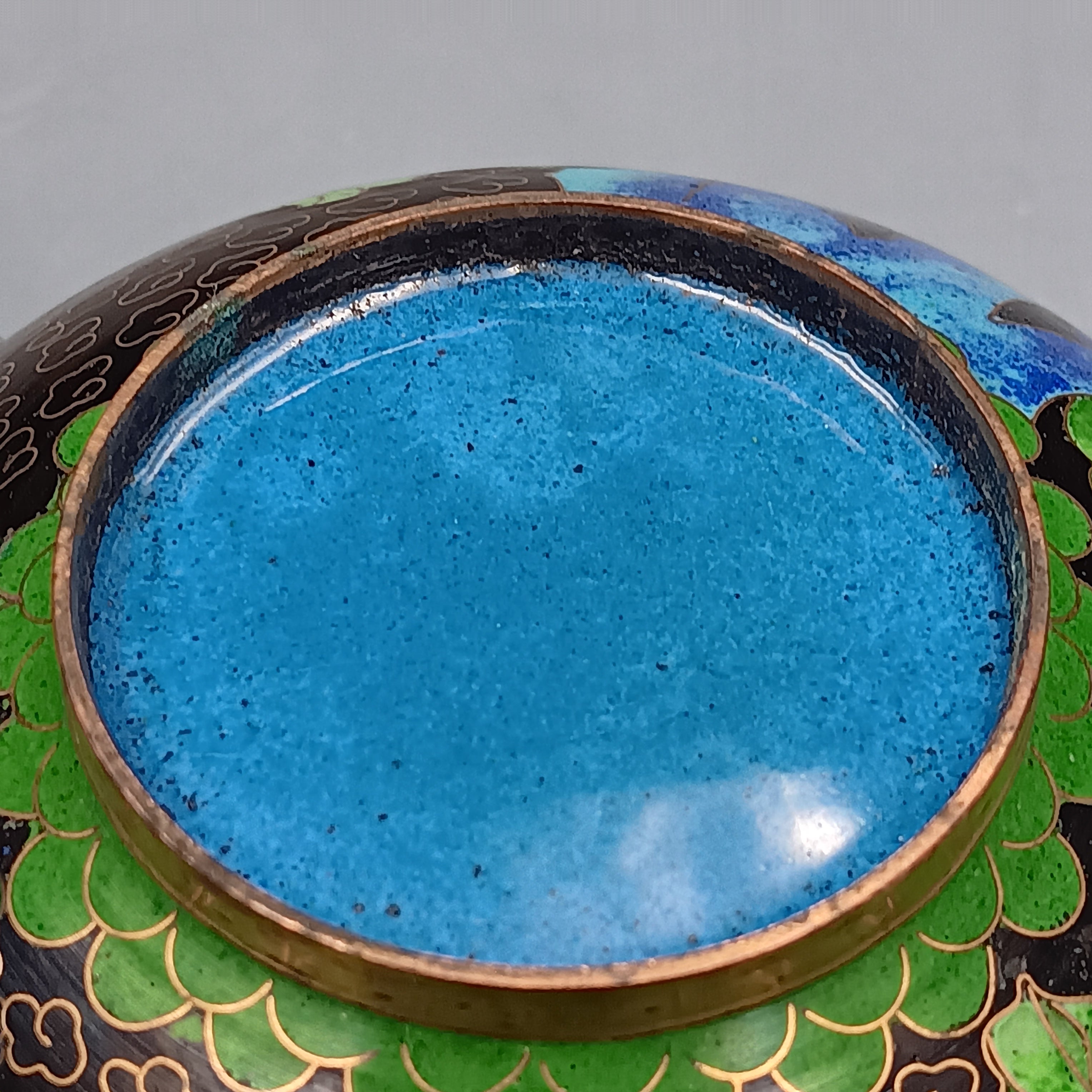 Mid-century Chinese cloisonné enamel bowl with blue interior and floral brass exterior, 5-inch diameter