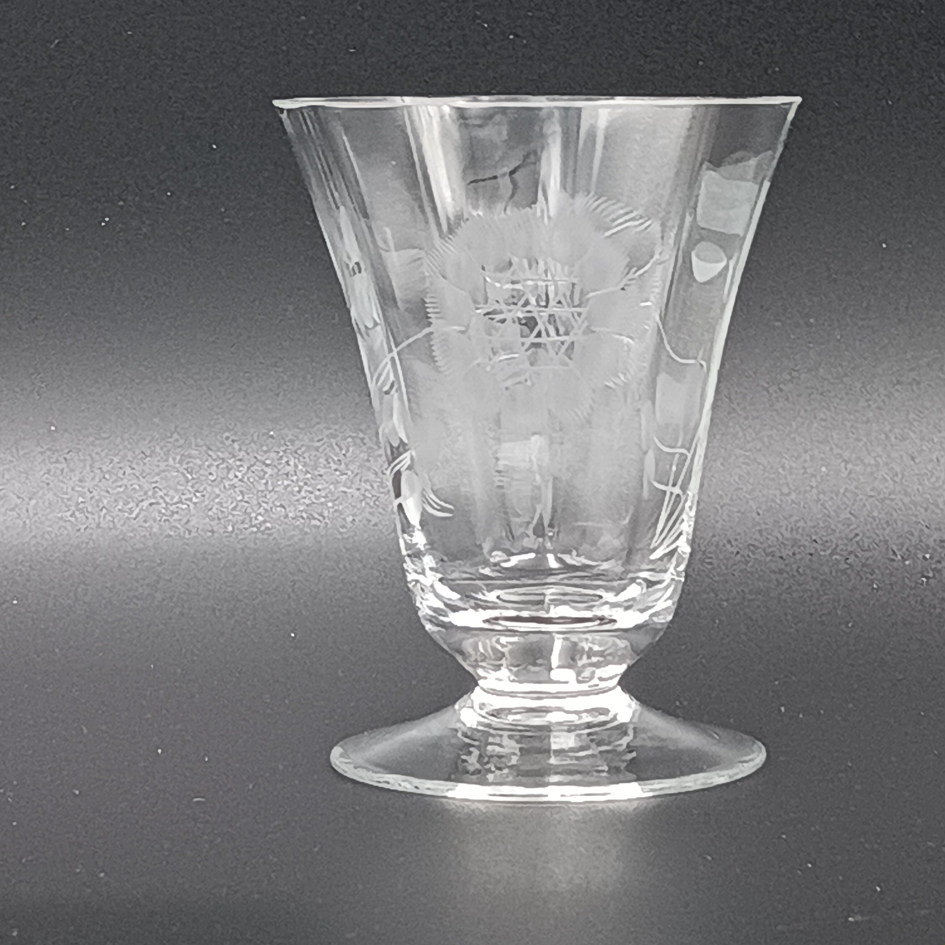Clear glass W.J. Hughes Cornflower footed tumbler with etched floral design, wide rim tapering to a flared circular base