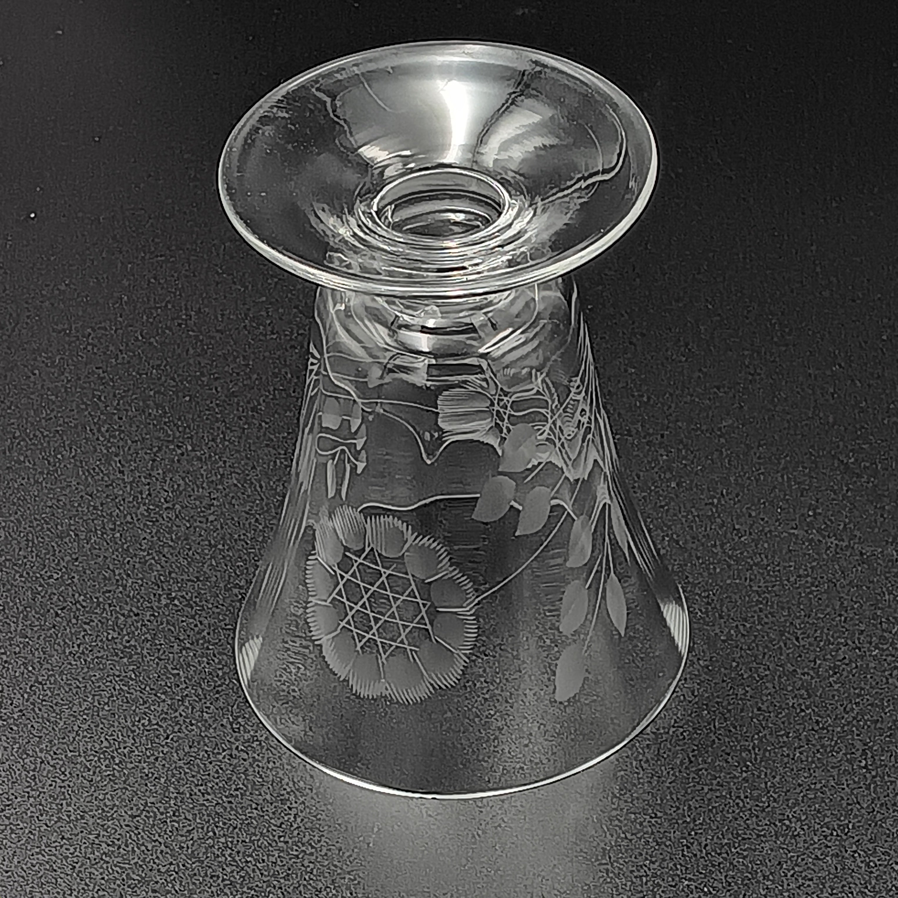 Clear glass W.J. Hughes Cornflower footed tumbler with etched floral design, wide rim tapering to a flared circular base