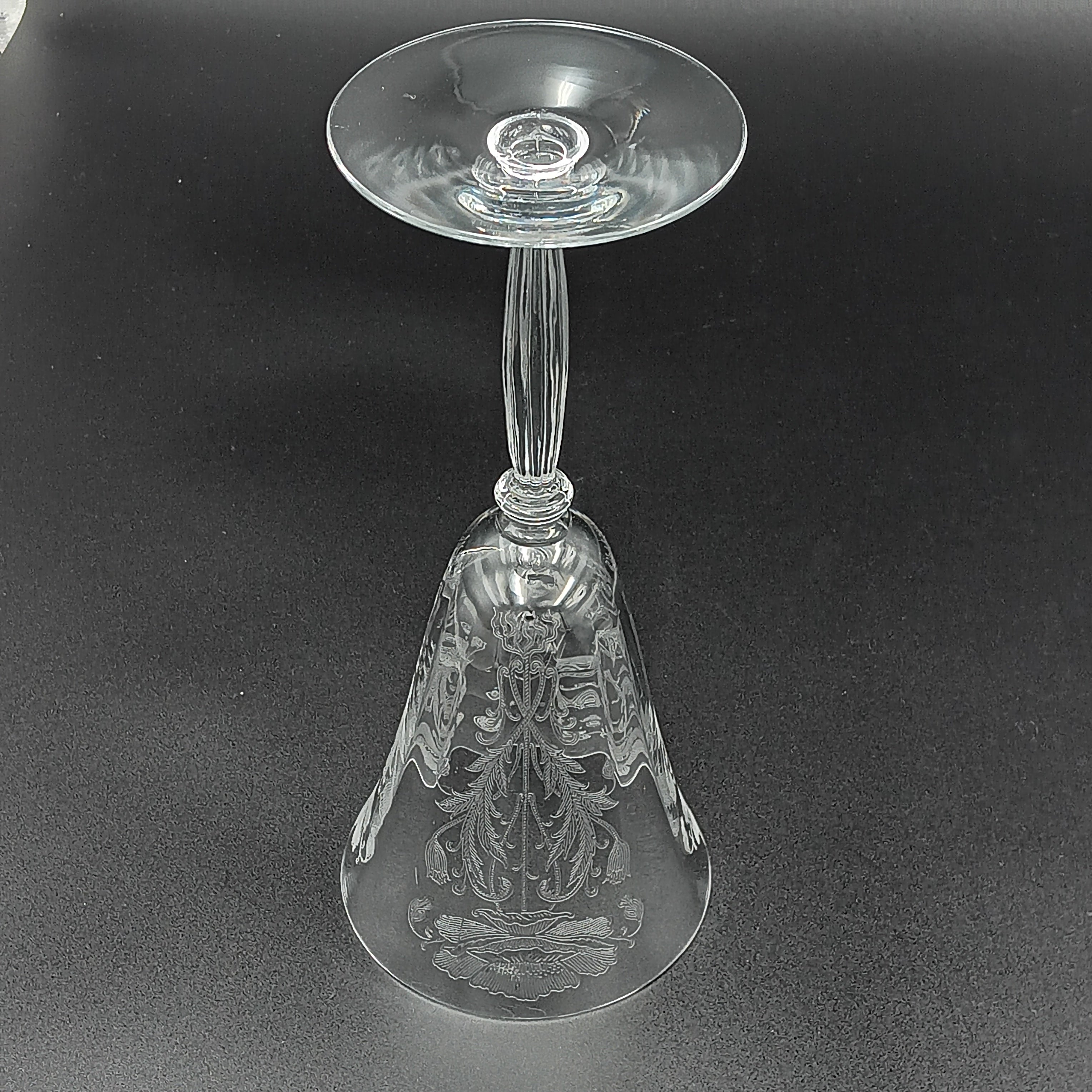 Vintage Tiffin-Franciscan 'Flanders Clear' 8¼ inch water goblet featuring intricate floral etching on the bowl, a ribbed stem, and a flat circular base.