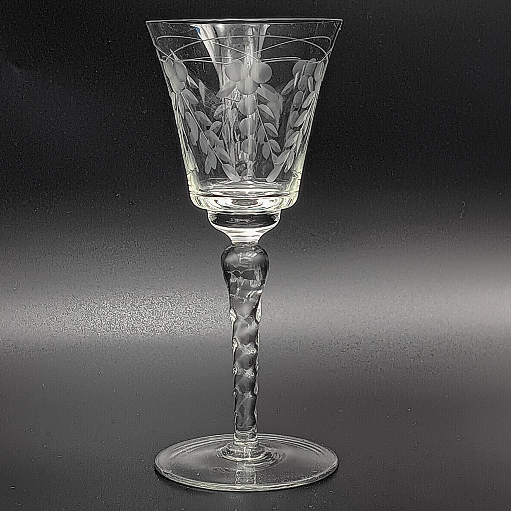 A 6-inch cut crystal wine glass featuring etched leaf and berry patterns on the bowl, a twisted textured stem, and a flat base.