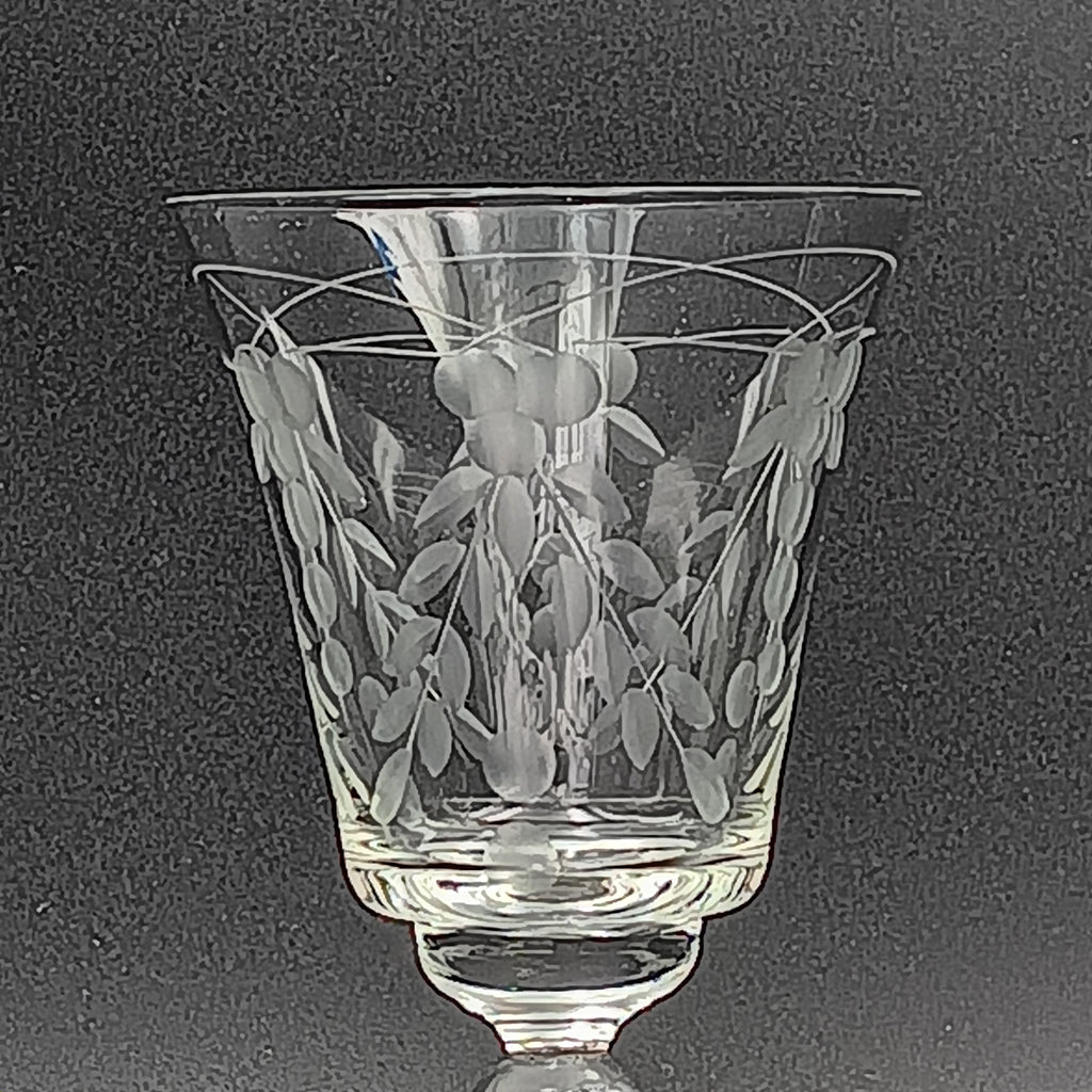 A 6-inch cut crystal wine glass featuring etched leaf and berry patterns on the bowl, a twisted textured stem, and a flat base.