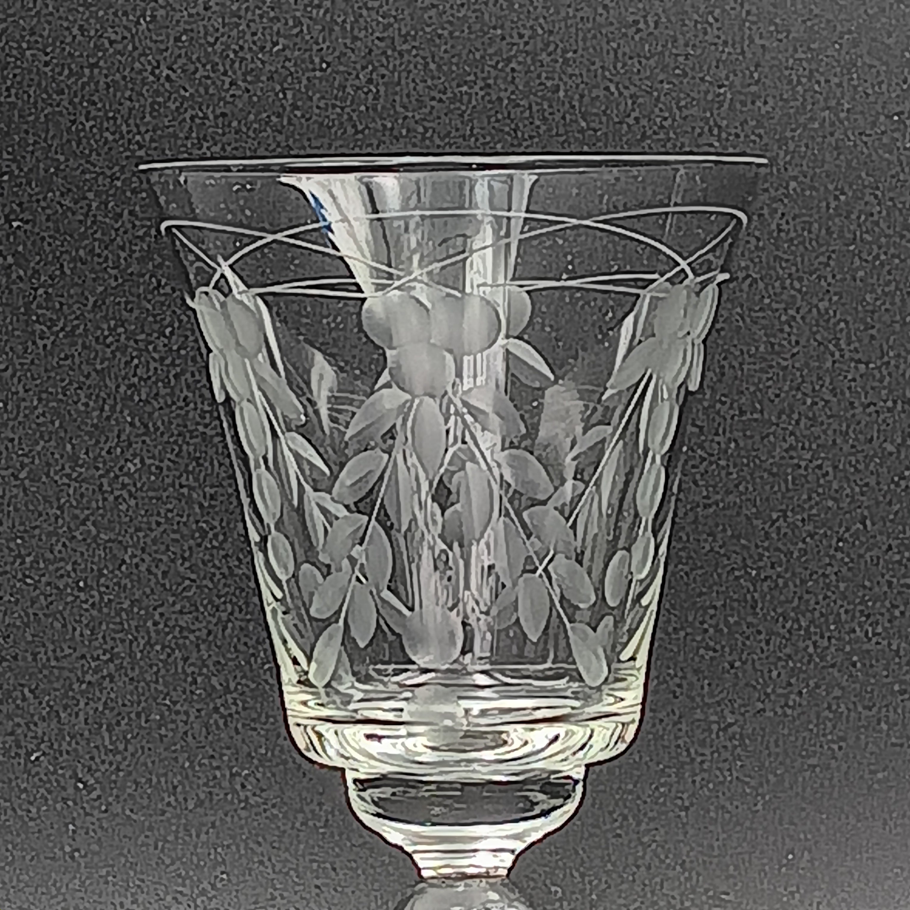 A 6-inch cut crystal wine glass featuring etched leaf and berry patterns on the bowl, a twisted textured stem, and a flat base.