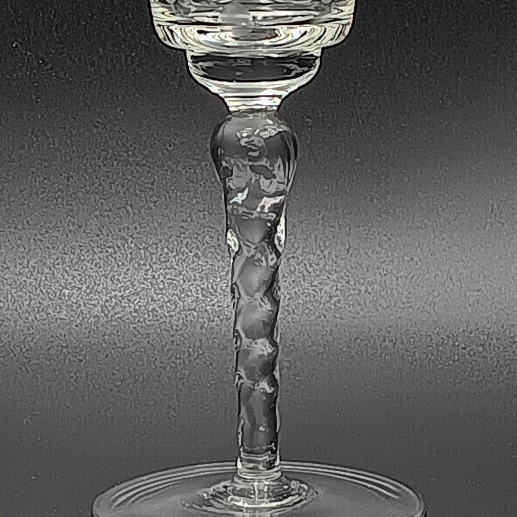 A 6-inch cut crystal wine glass featuring etched leaf and berry patterns on the bowl, a twisted textured stem, and a flat base.