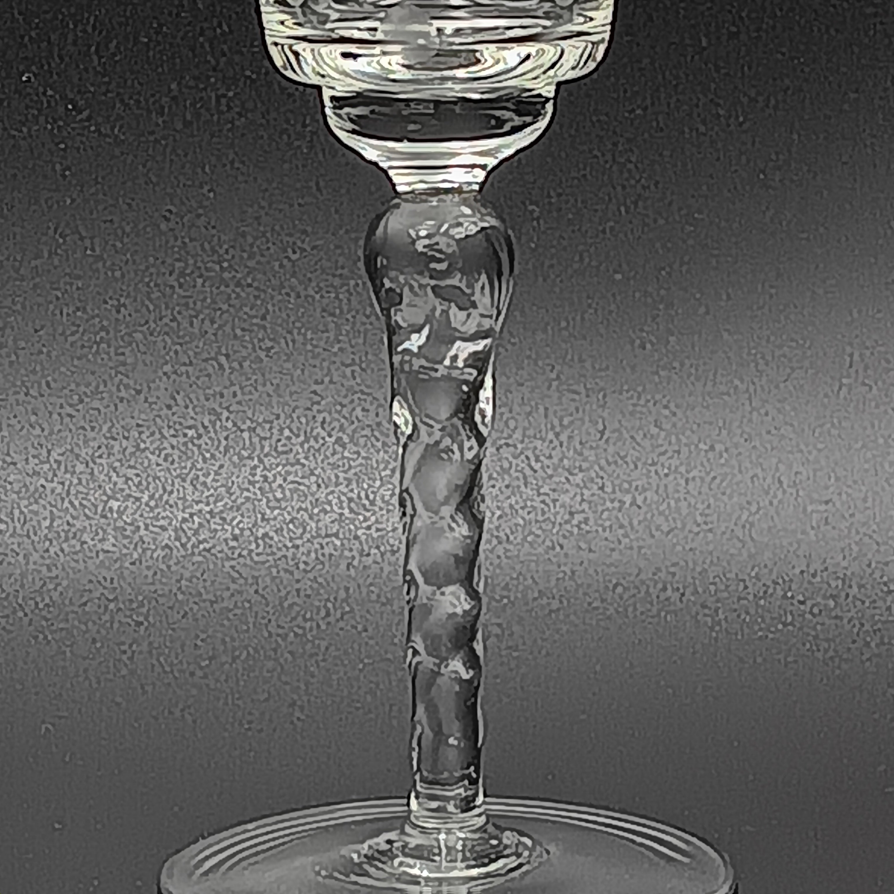 A 6-inch cut crystal wine glass featuring etched leaf and berry patterns on the bowl, a twisted textured stem, and a flat base.