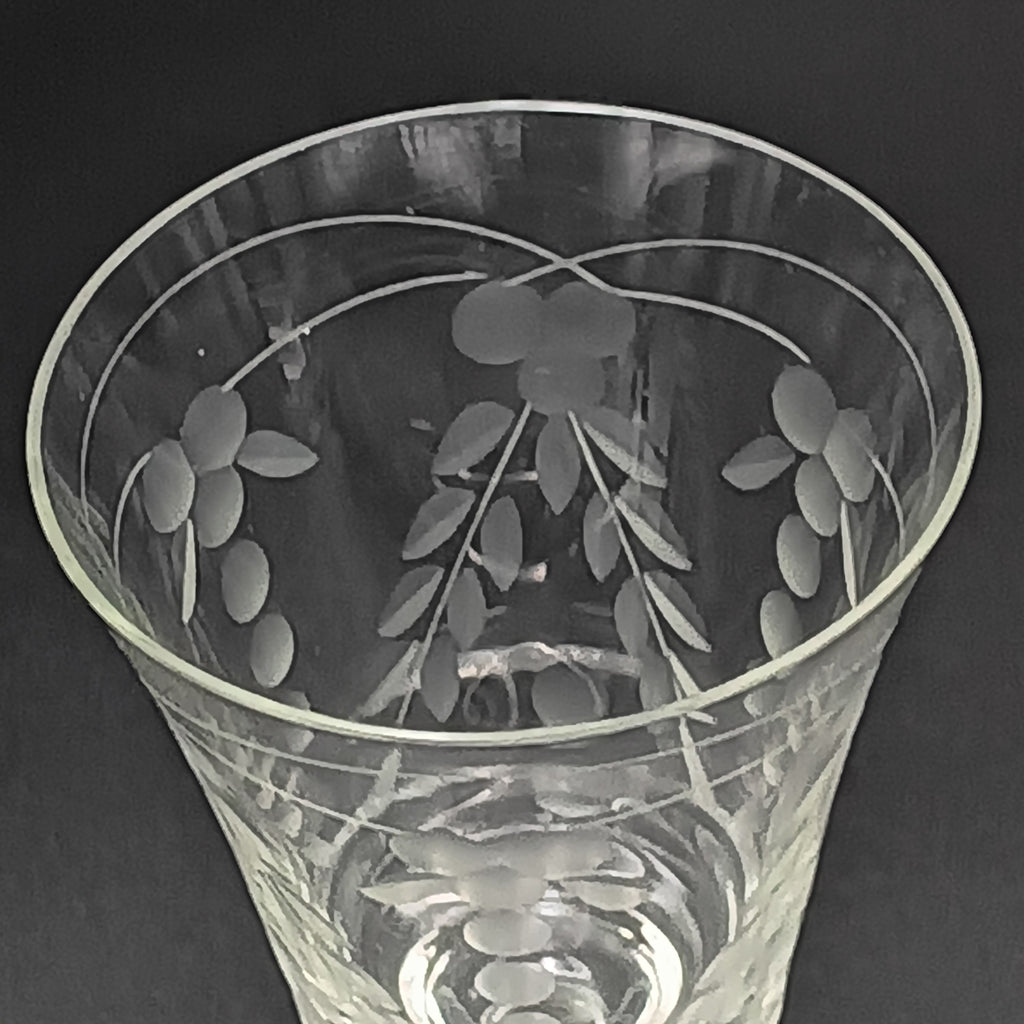 A 6-inch cut crystal wine glass featuring etched leaf and berry patterns on the bowl, a twisted textured stem, and a flat base.