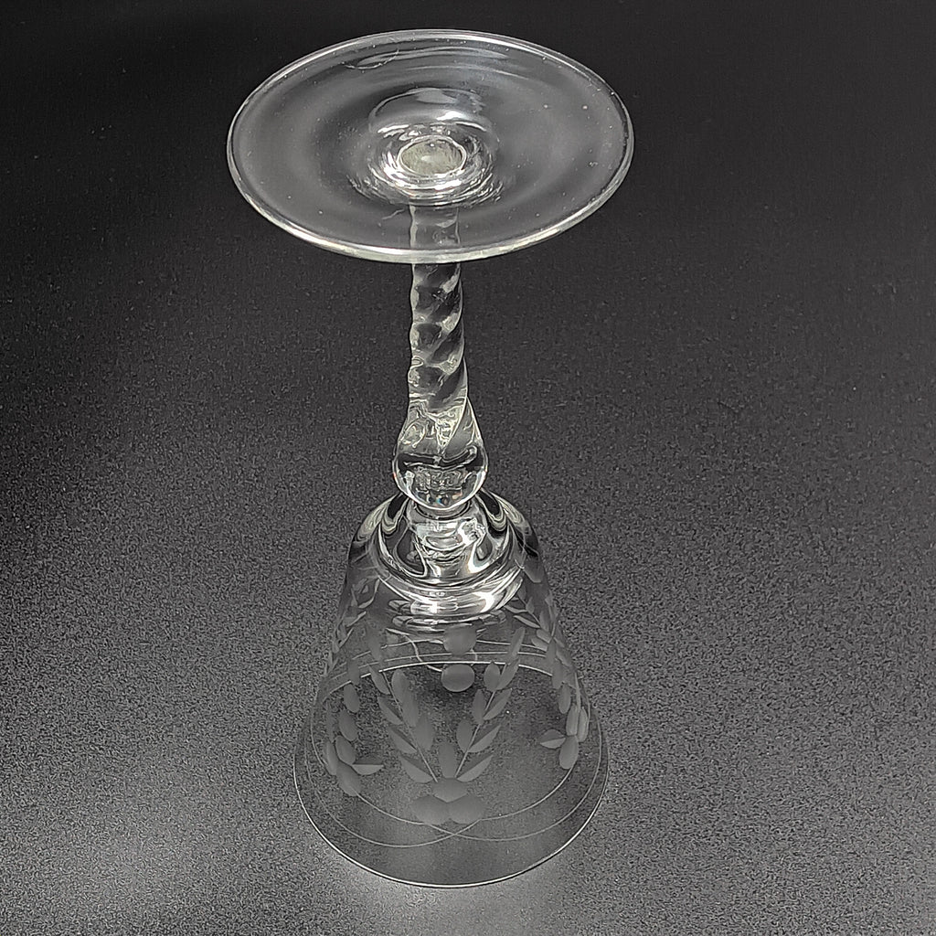 A 6-inch cut crystal wine glass featuring etched leaf and berry patterns on the bowl, a twisted textured stem, and a flat base.
