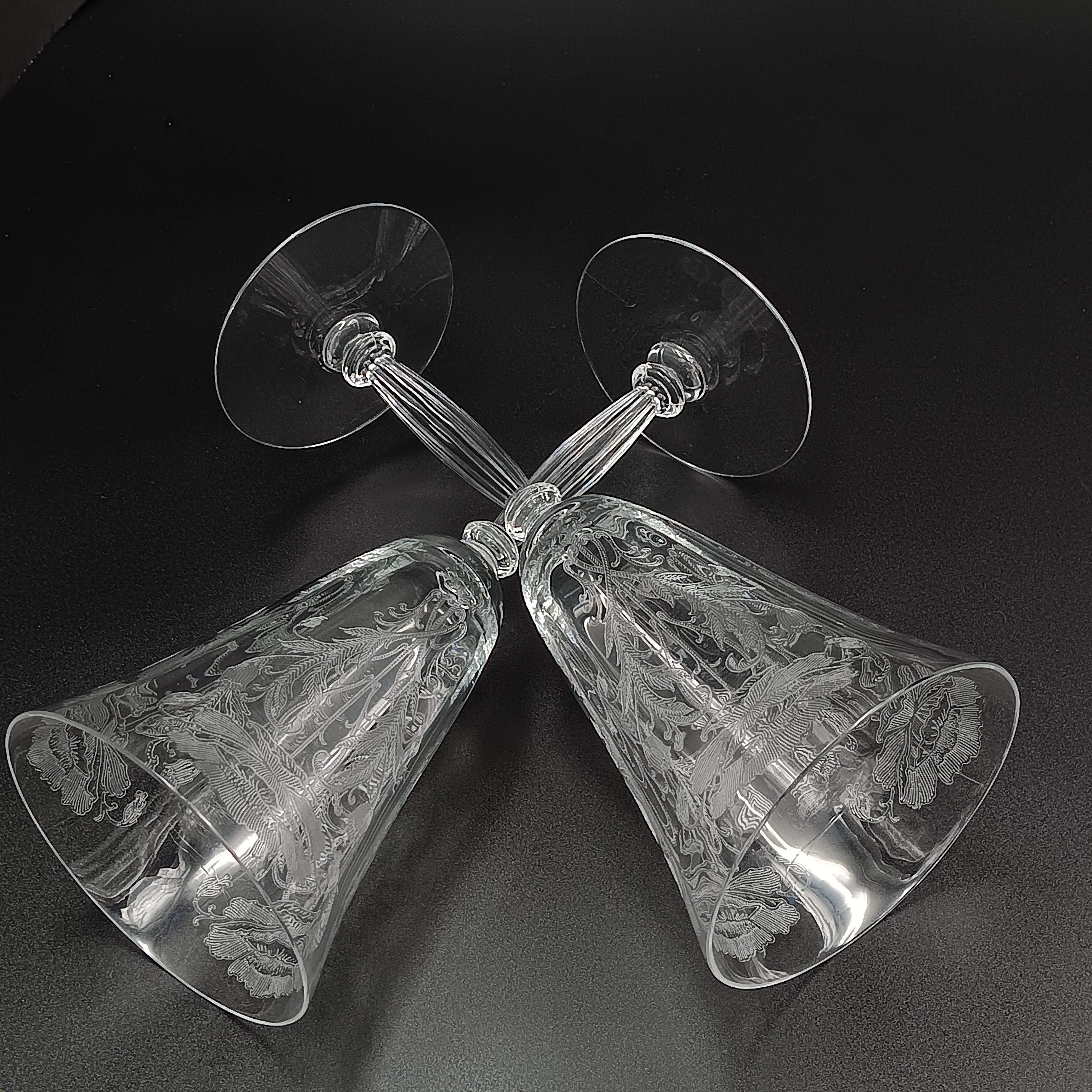 Vintage Tiffin-Franciscan 'Flanders Clear' 8¼ inch water goblet featuring intricate floral etching on the bowl, a ribbed stem, and a flat circular base.