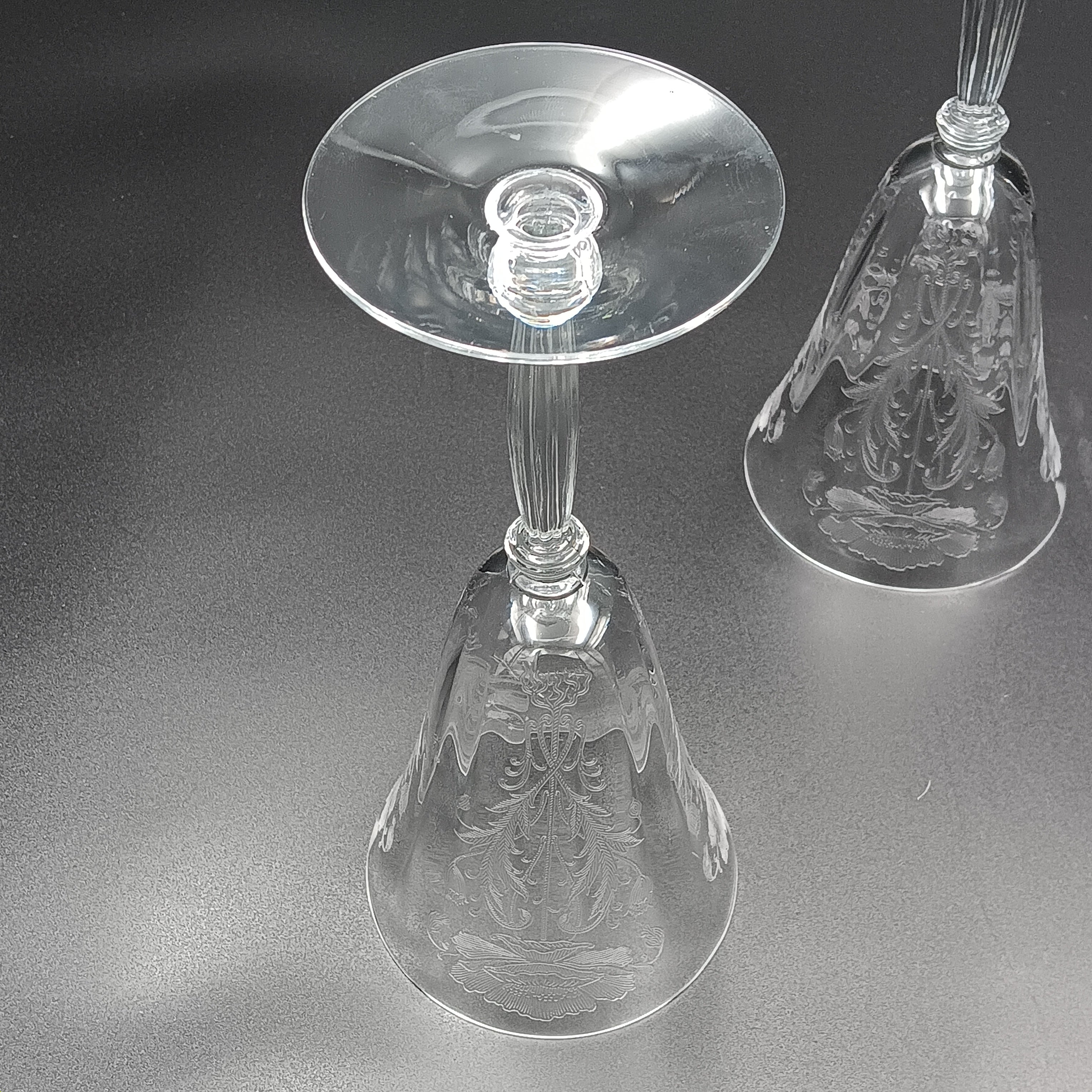 Vintage Tiffin-Franciscan 'Flanders Clear' 8¼ inch water goblet featuring intricate floral etching on the bowl, a ribbed stem, and a flat circular base.