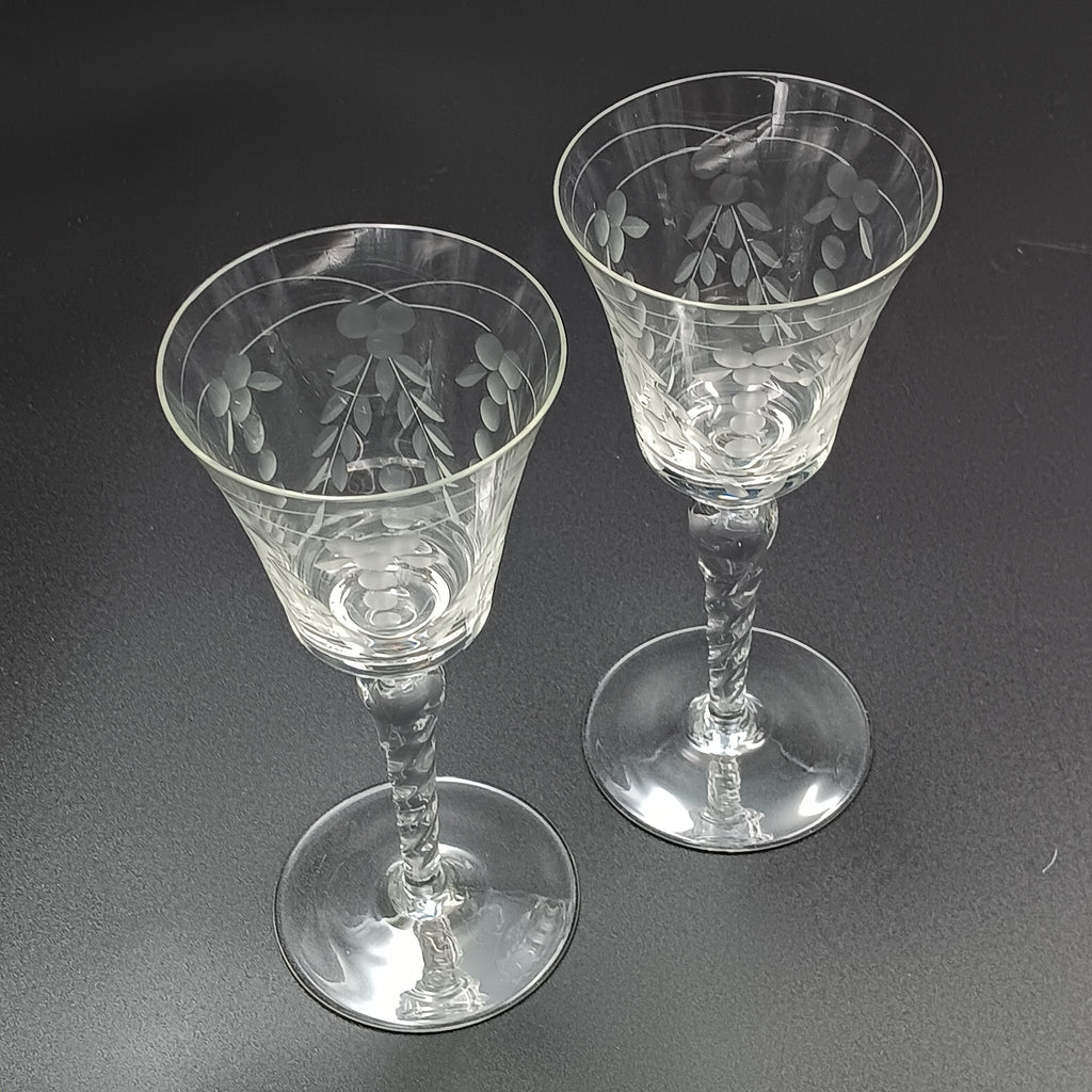 A 6-inch cut crystal wine glass featuring etched leaf and berry patterns on the bowl, a twisted textured stem, and a flat base.