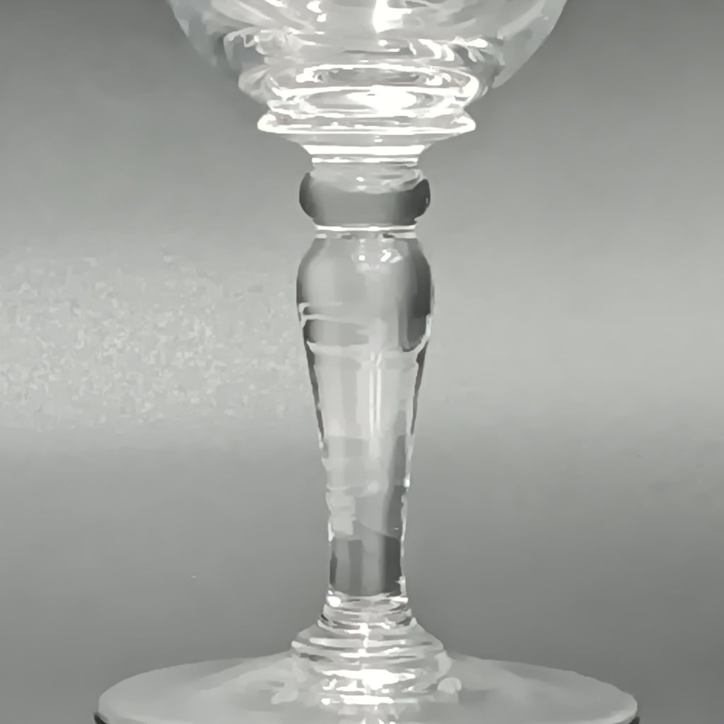 Clear 4½-inch etched crystal wine glass with ornate floral and crown-like patterns on the bowl, faceted stem, and wide flat base