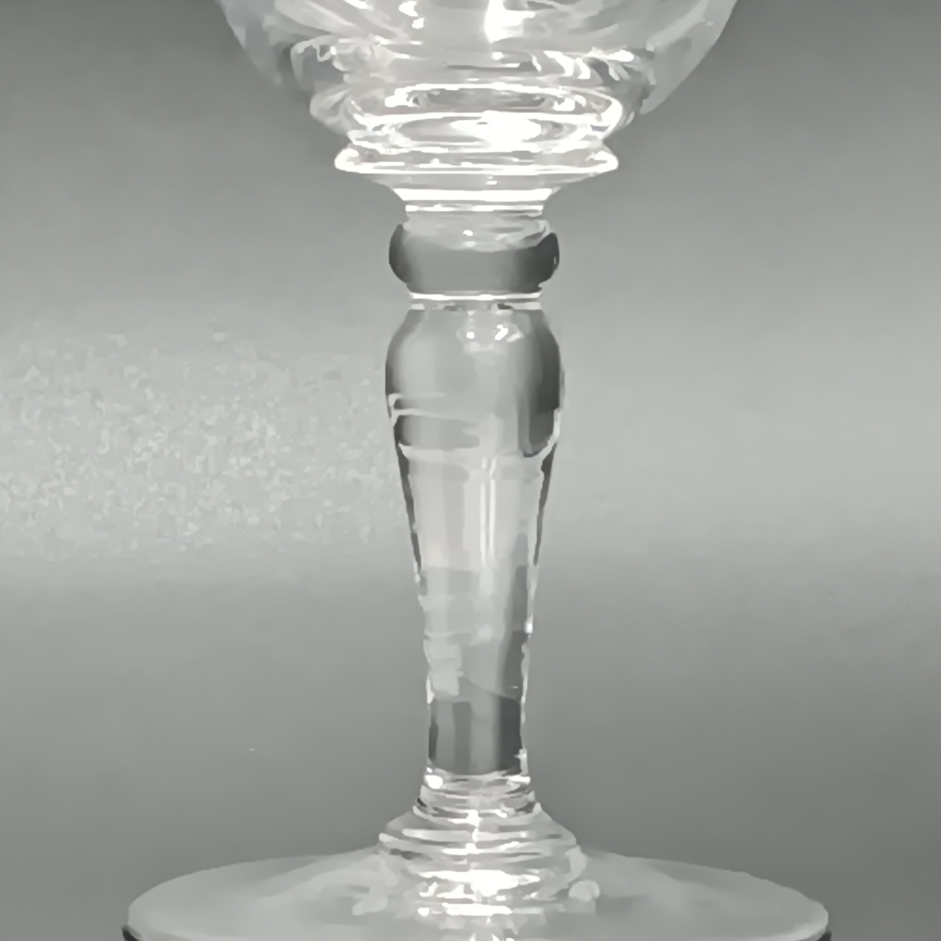 Clear 4½-inch etched crystal wine glass with ornate floral and crown-like patterns on the bowl, faceted stem, and wide flat base