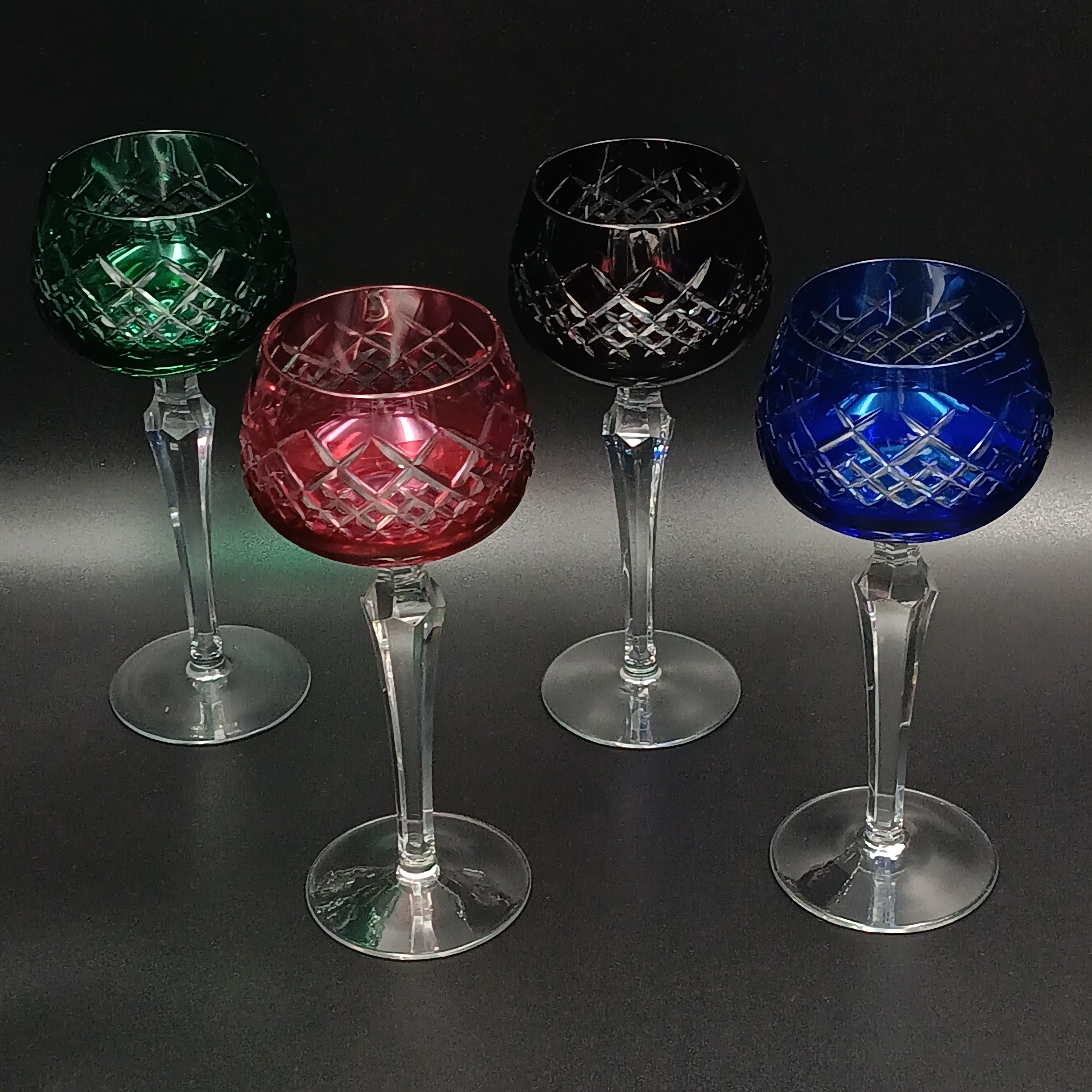Elegant 7 5/8-inch cut to clear crystal wine glasses with diamond-cut bowl, faceted clear stem, and round clear base