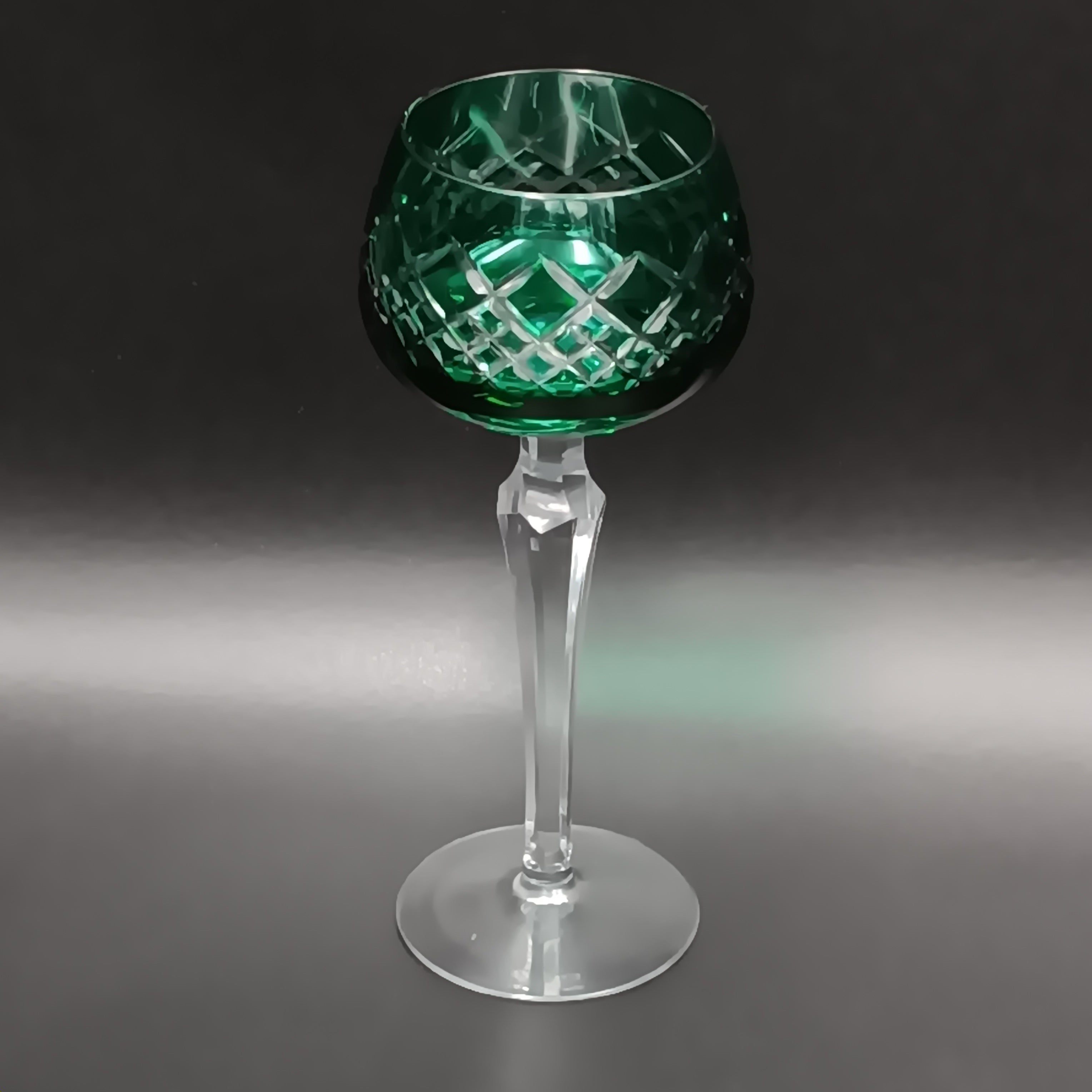 Elegant 7 5/8-inch cut to clear crystal wine glass with emerald green diamond-cut bowl, faceted clear stem, and round clear base