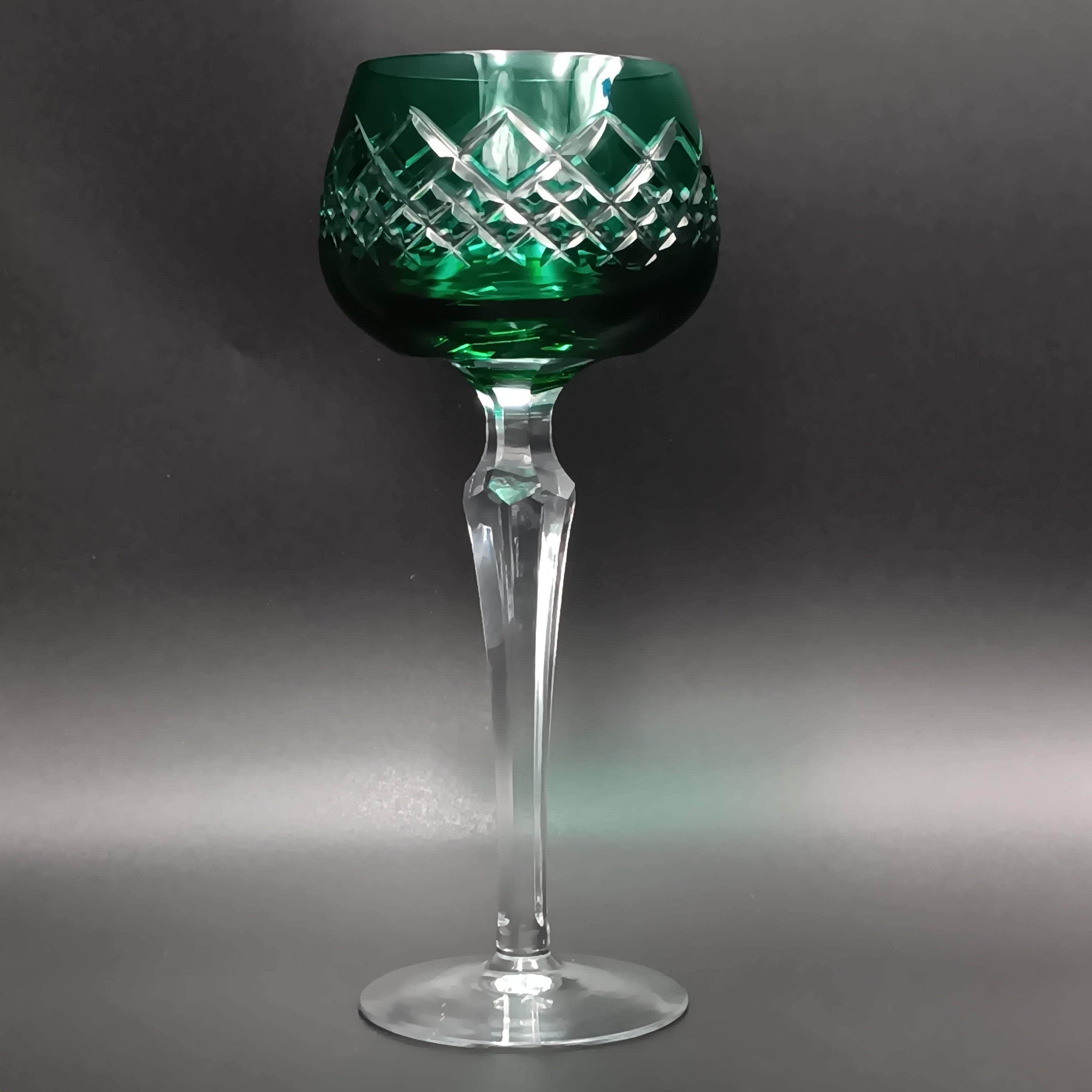 Elegant 7 5/8-inch cut to clear crystal wine glass with emerald green diamond-cut bowl, faceted clear stem, and round clear base