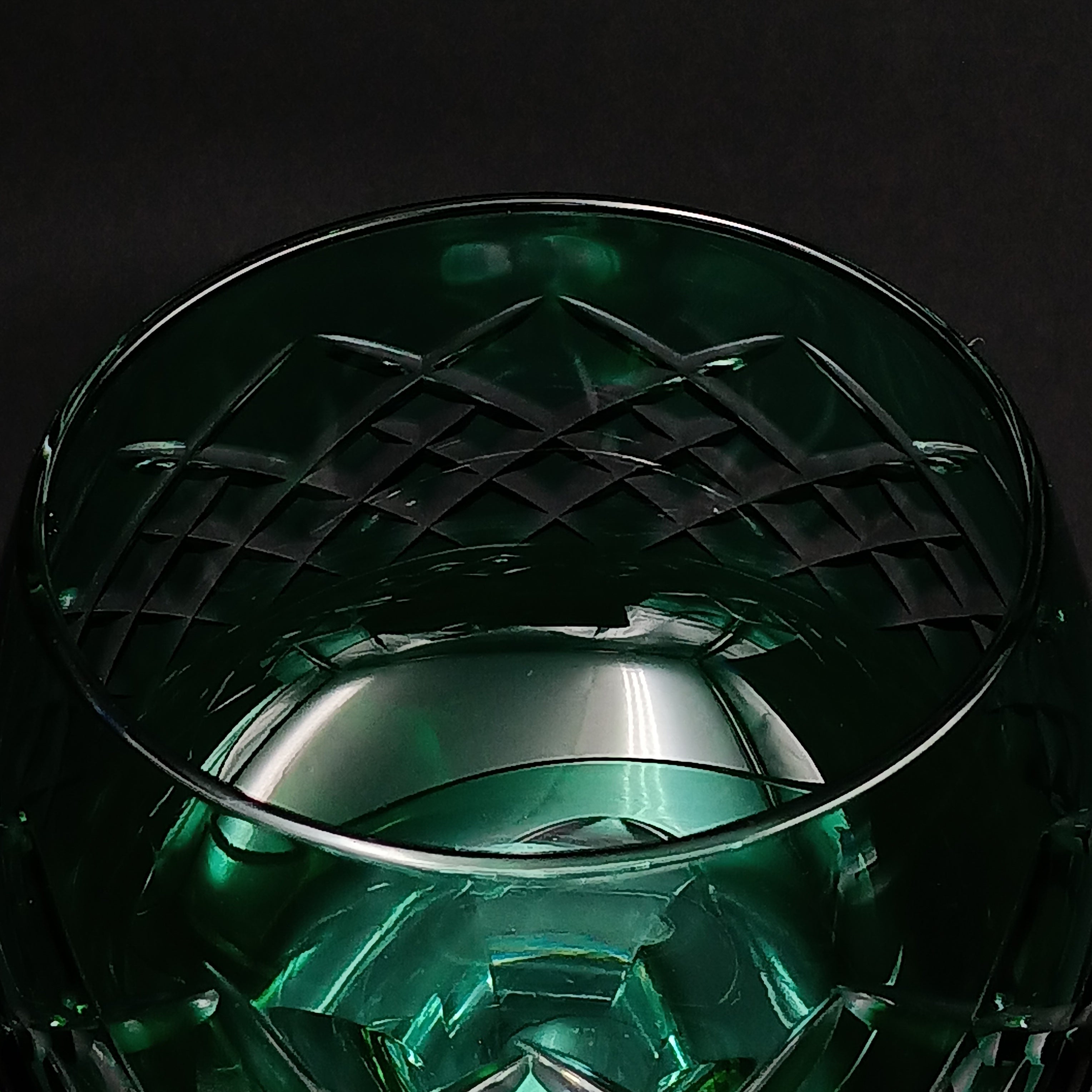Elegant 7 5/8-inch cut to clear crystal wine glass with emerald green diamond-cut bowl, faceted clear stem, and round clear base