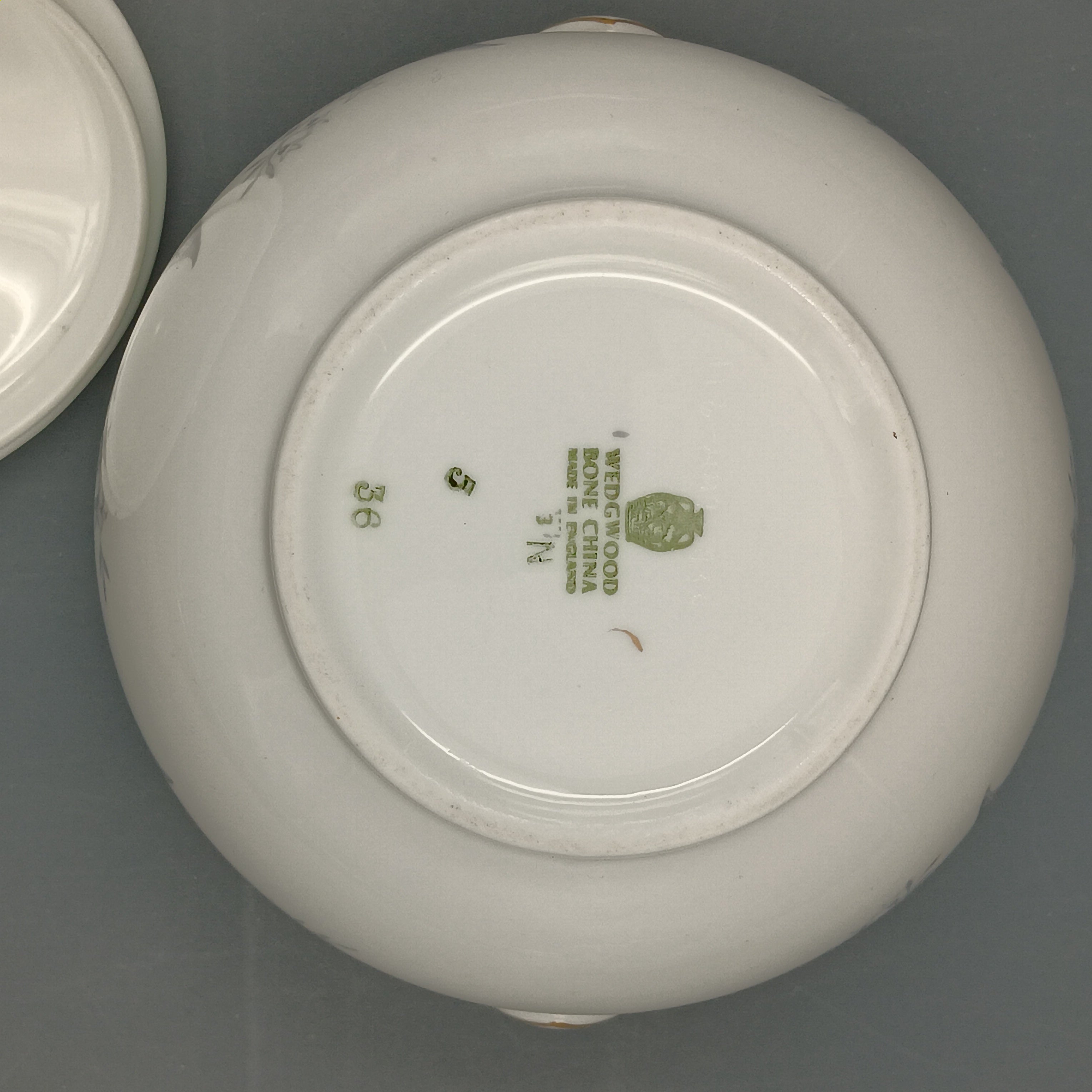 Vintage Wedgwood ‘Buxton Turquoise’ lidded sugar dish with white porcelain body, turquoise band, gray floral motif, and gold-trimmed handles and lid.