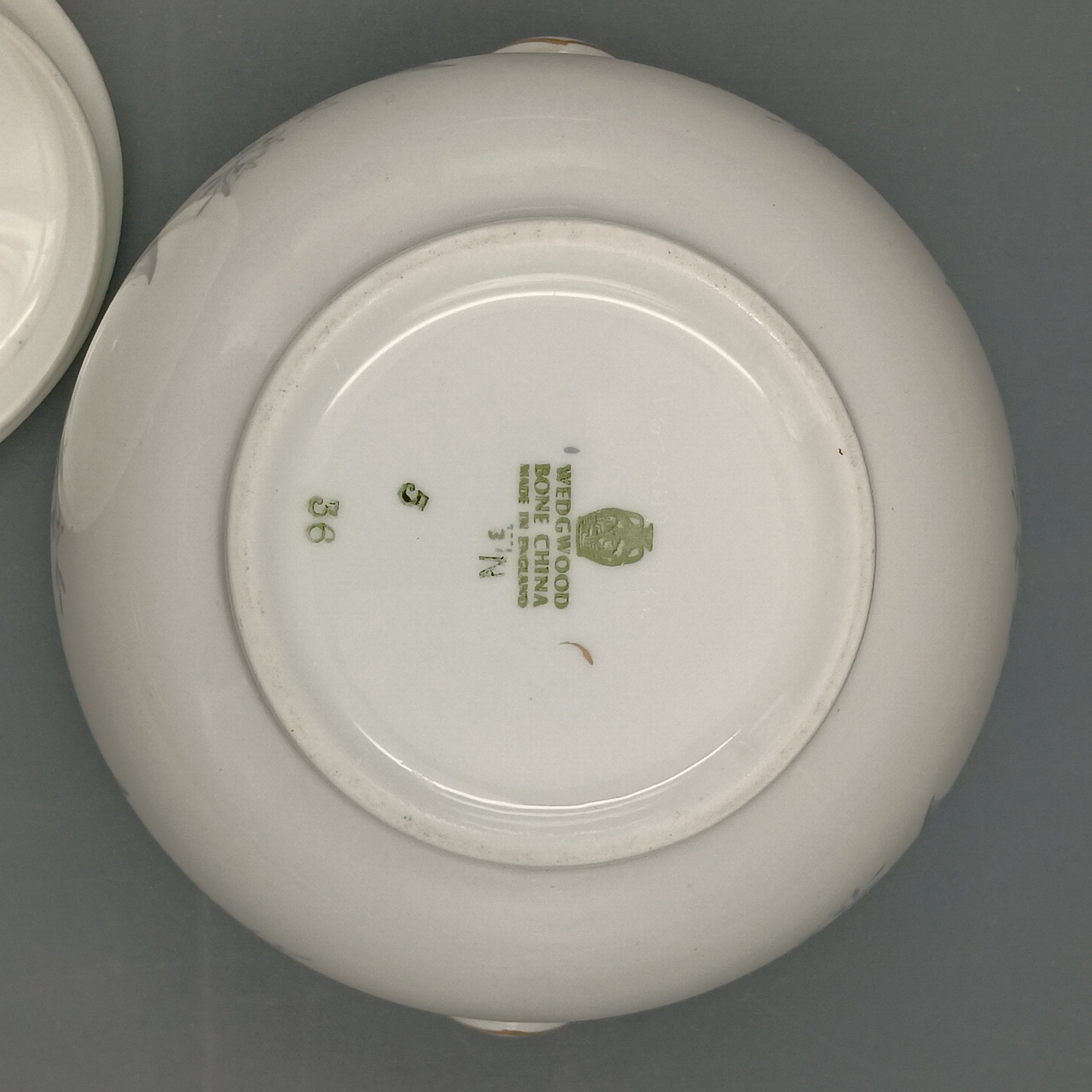 Sugar dish with floral design on a gray background