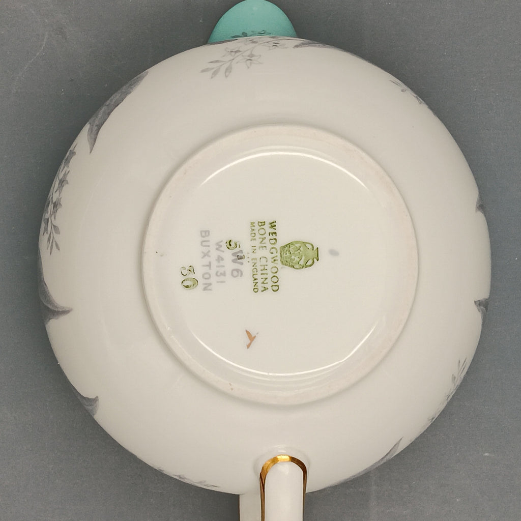 Wedgwood Buxton Turquoise creamer with gold trim, featuring a turquoise band and gray botanical motif on white porcelain