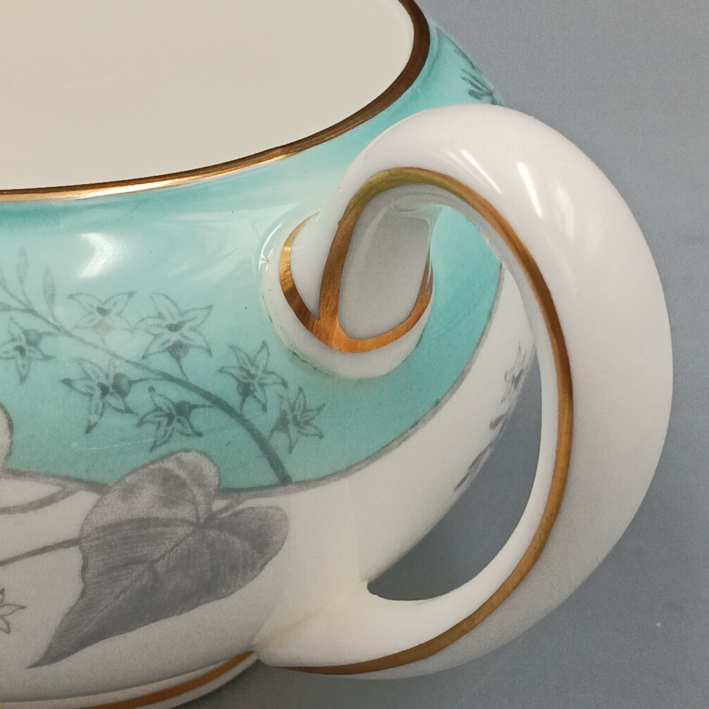 Wedgwood Buxton Turquoise creamer with gold trim, featuring a turquoise band and gray botanical motif on white porcelain