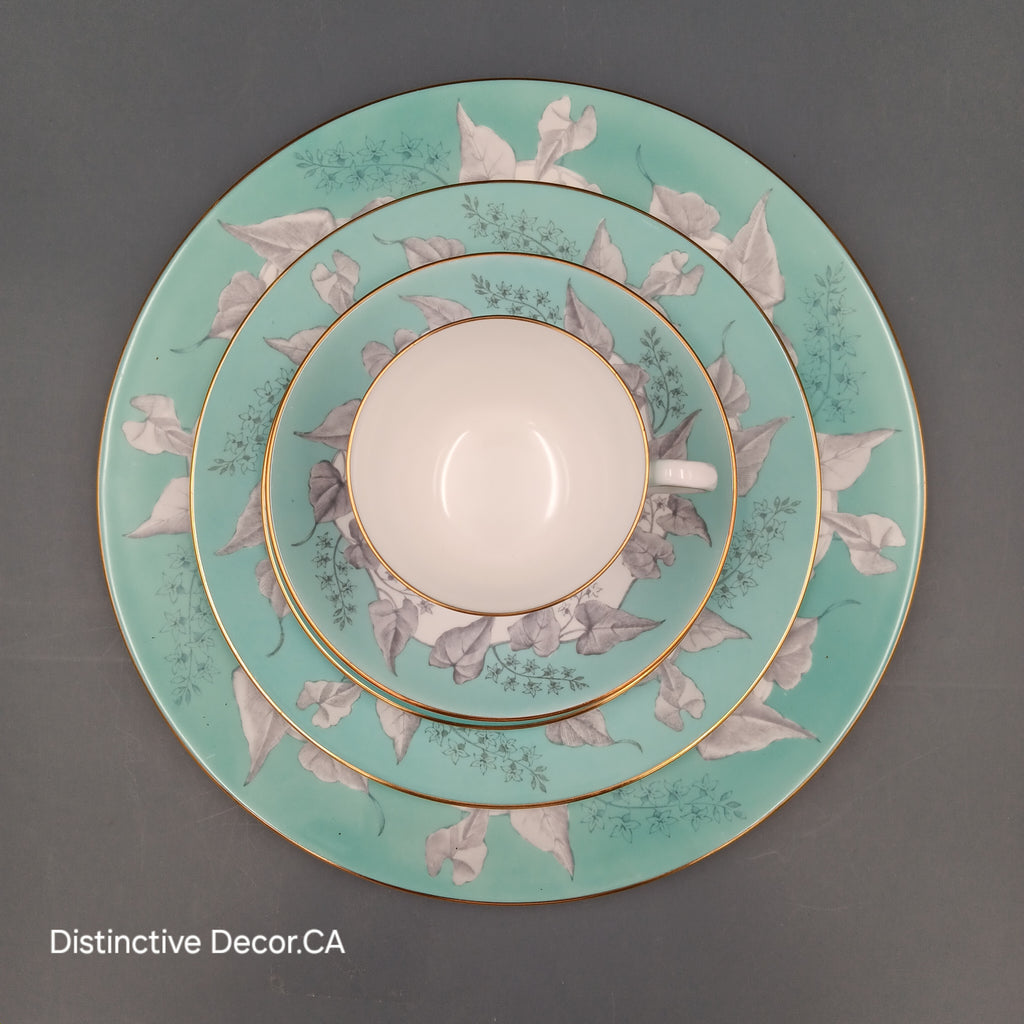 Wedgwood 'Buxton Turquoise' 5-piece vintage dinnerware set featuring a teacup, saucer, and three plates with turquoise floral borders, gold rims, and white porcelain centers.