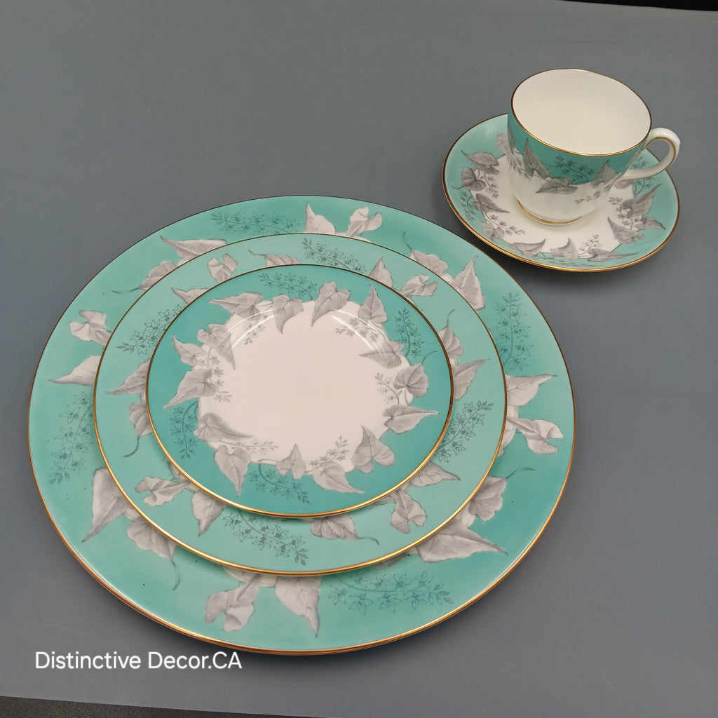 Wedgwood 'Buxton Turquoise' 5-piece vintage dinnerware set featuring a teacup, saucer, and three plates with turquoise floral borders, gold rims, and white porcelain centers.