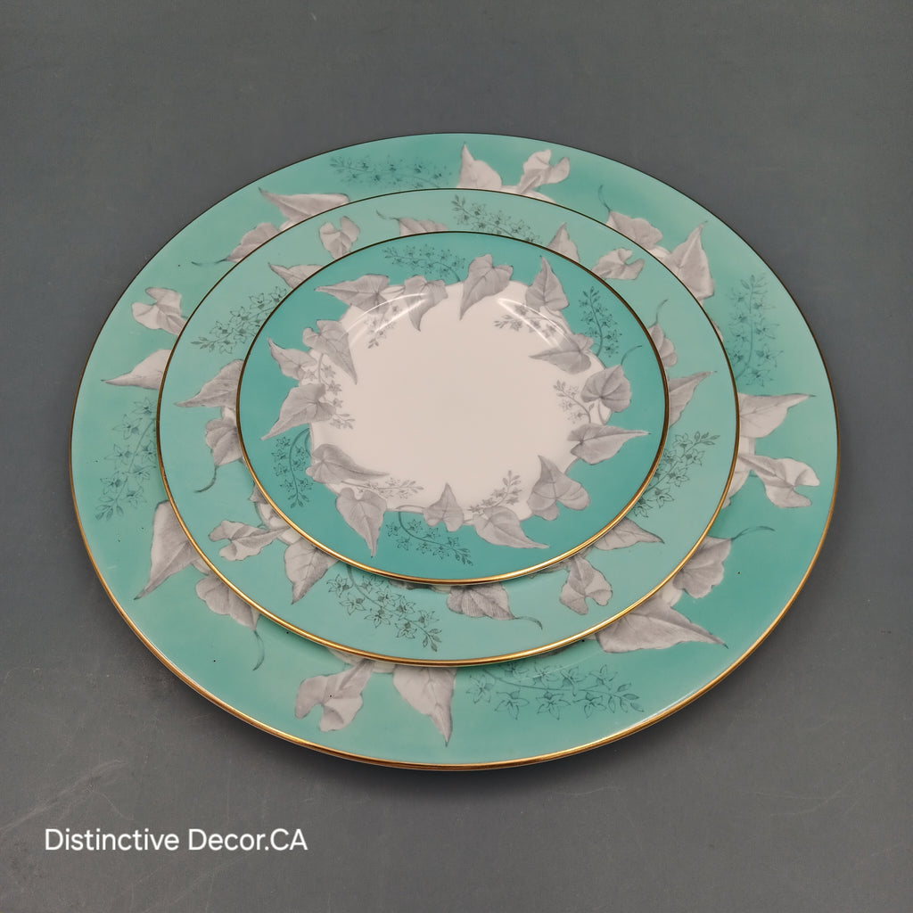 Wedgwood 'Buxton Turquoise' 5-piece vintage dinnerware set featuring a teacup, saucer, and three plates with turquoise floral borders, gold rims, and white porcelain centers.