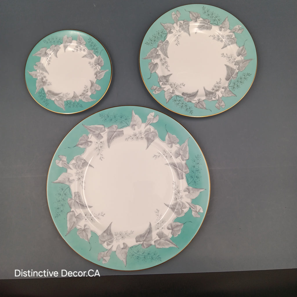 Three decorative plates with floral patterns on a gray background, branded 'Distinctive Decor'.